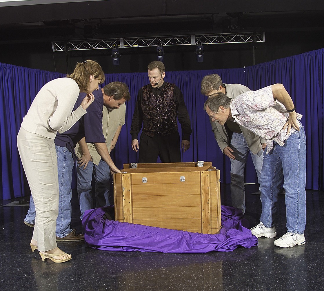 Parents joining Brock Edwards onstage during the magic show