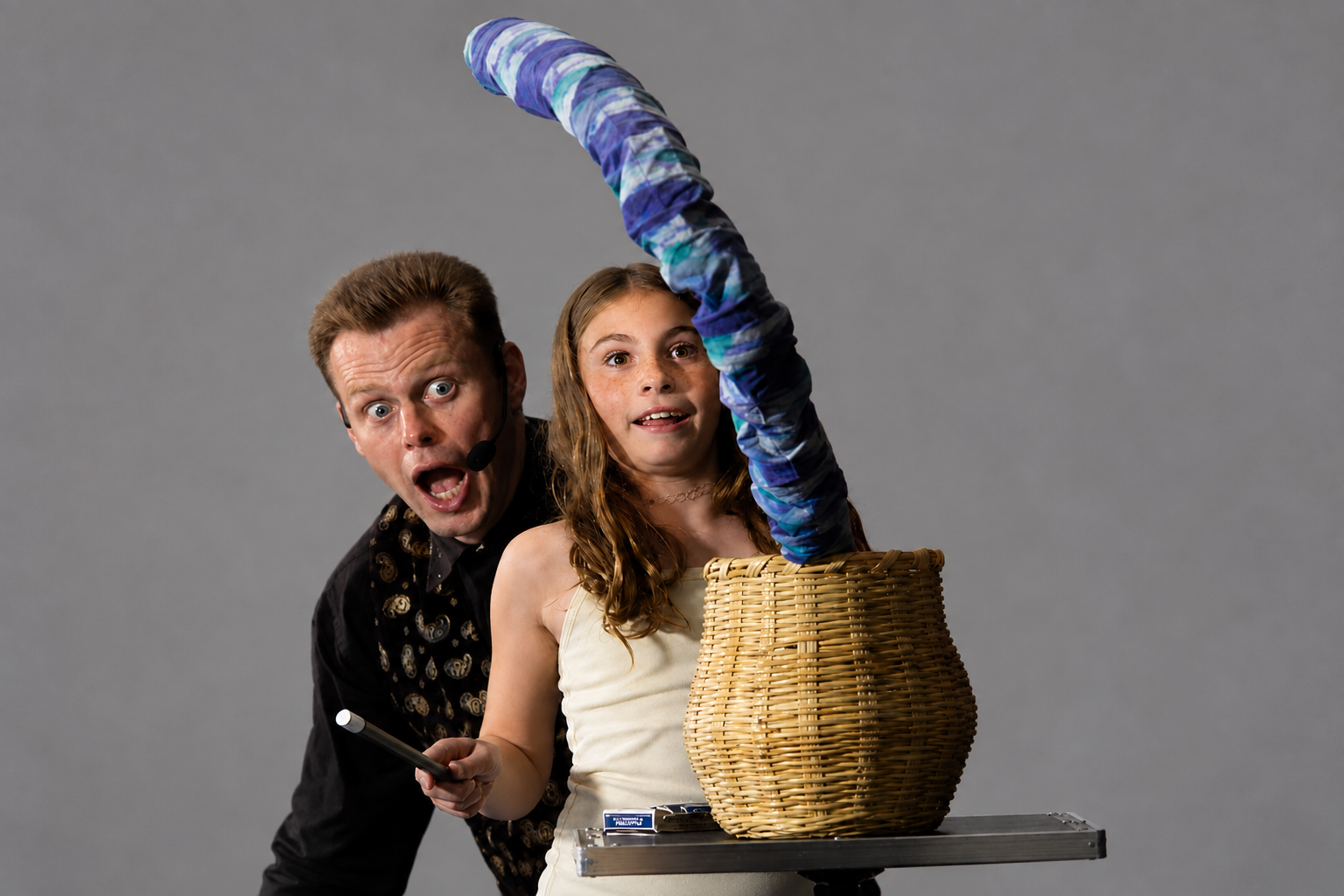 Brock Edwards performing the snake basket illusion for a school audience